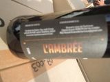 a bottle of wine sitting on top of a cardboard box