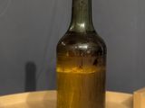 a bottle of wine sitting on a wooden table