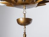 a close up of a chandelier with a light bulb hanging from it
