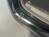 the trunk of a car with its door open and the trunk door open