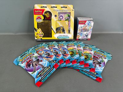 a close up of a box of pokemon cards on a table