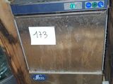 a silver dishwasher sitting on top of a wooden counter