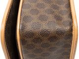 the inside of a brown and tan purse