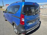 a blue van that is parked on the side of the road