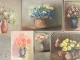 four paintings of flowers in vases on the wall