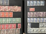 many different stamps on the pages of a book