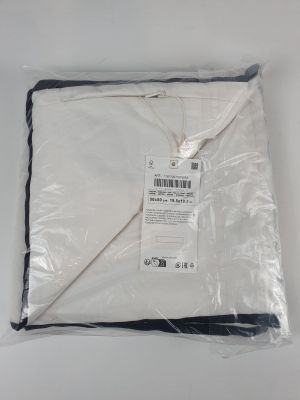 the white blanket is wrapped in plastic and ready to be used