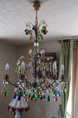 a chandelier that is hanging from the ceiling in the room