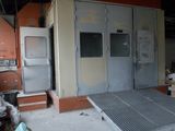 an image of a room with a metal door and a metal ramp