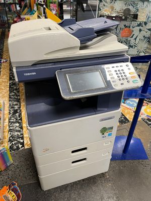 an image of a multi - function printer sitting on top of a table