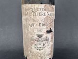 a bottle of wine that is sitting on a table