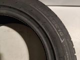 a close up of a tire on a white surface
