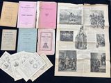 some old papers and pamphlets are sitting on a table