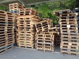 many wooden pallets stacked on top of each other