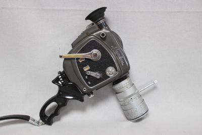 a black and white photo of a gun and a lighter