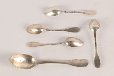 several spoons and spoon spoons are lined up on a white surface