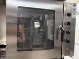a large stainless steel oven sitting in a kitchen