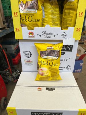 boxes of potato chips are stacked on top of each other in a store