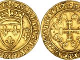 a gold coin with a crown on the front and a shield on the back