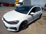 the volkswagen golf gtr is parked in a parking lot