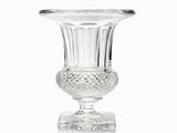 a glass vase that is sitting on a table