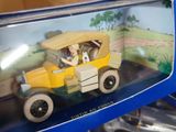 a toy car in the box on the table