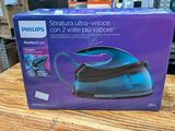 the box of the philips steam iron is on a wooden table