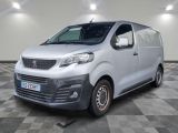 the silver van is parked on a checkered floor in a room