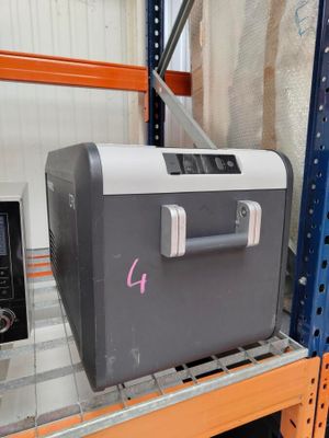 an image of a cooler sitting on a shelf in a warehouse
