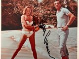 an old photo of a man and a woman on the beach