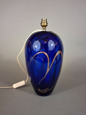 an image of a blue vase with a gold swirl on it