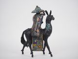 a statue of a man riding a horse with a hat on