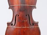 an old cello on a stand against a white background