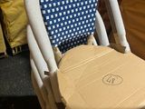 a cardboard chair with a box on the back of it