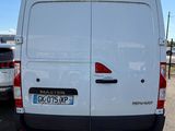 the back of a white van parked in a parking lot