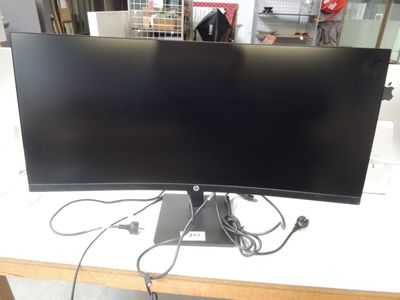 a computer monitor sitting on top of a table