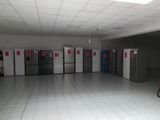 several refrigerators are lined up in a large room with white tile flooring