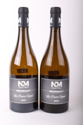 two bottles of wine sitting next to each other on a table