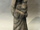 a statue of a woman holding a baby in her arms