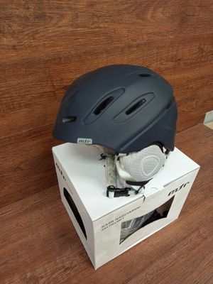 a helmet sitting on top of a box on the floor
