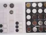 a lot of coins in a plastic box on the table