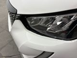 a close up of a car ' s headlight on display at a car show