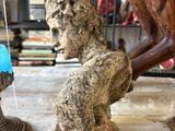 a statue of a horse and a statue of a dog on a table