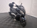 a motorcycle that is parked on a checkered floor