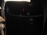 an image of a small black refrigerator in a room