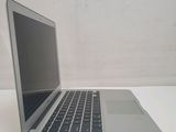 a laptop computer sitting on a table with a white background