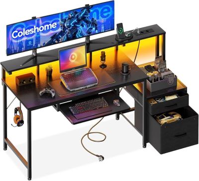 a computer desk with two monitors and a keyboard on it