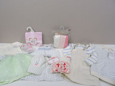a table with a lot of baby items on it