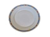 a white plate with blue and red designs on it