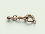 a close up of a metal hook with a chain attached to it